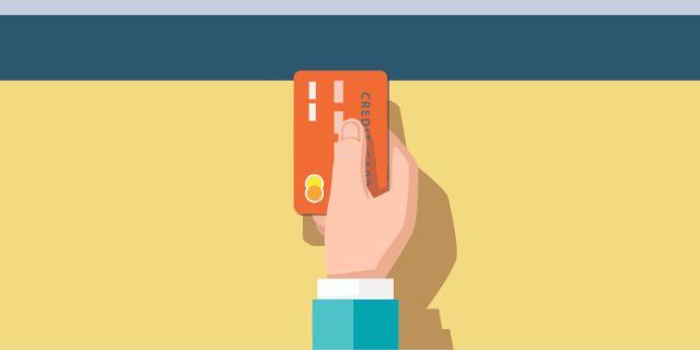 A person holding a credit card