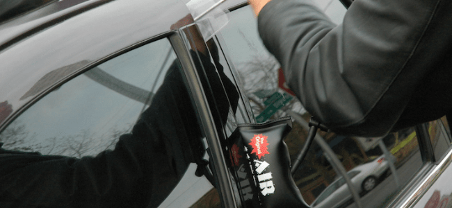 A Locksmith Unlocking A Car Door