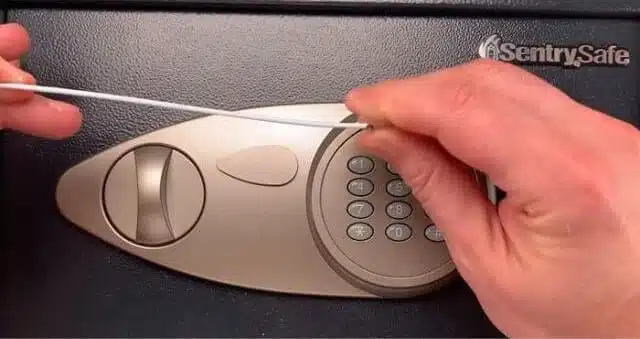 A person manually unlocking a Sentry Safe Without Combination