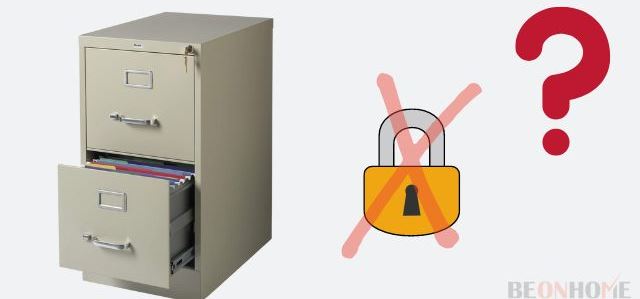 An opened file cabinet with a lock crossed