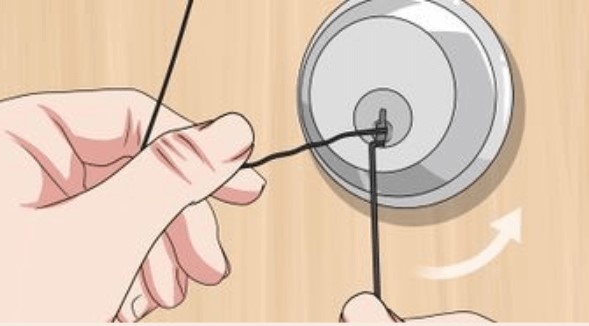 A person Rotating pins to pick a lock