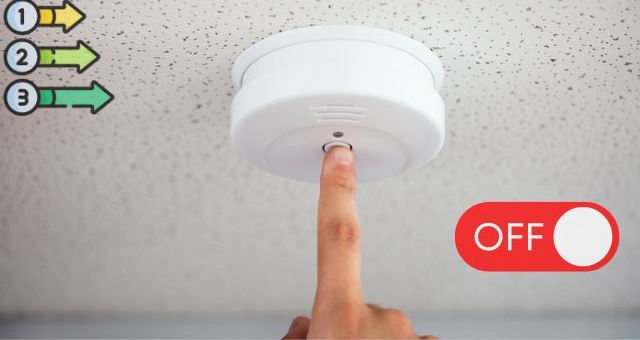 A person Turning Off The Smoke Alarm