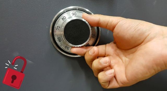 A person Unlocking a Safe Lock
